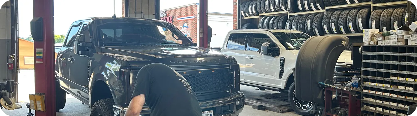 Two trucks in a service garage