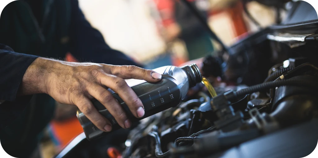 Oil Change Services in Missouri & Illinois At Charlie’s Tire and Fast Lube. Pouring oil into a car engine