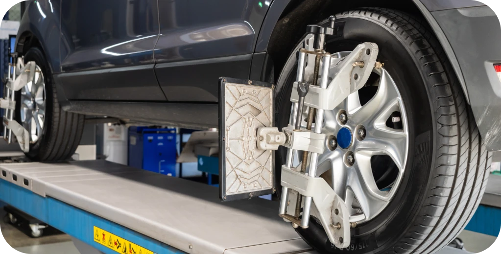 Wheel Alignment in MO & IL At Charlie’s Tire and Fast Lube. Car wheel alignment equipment in use