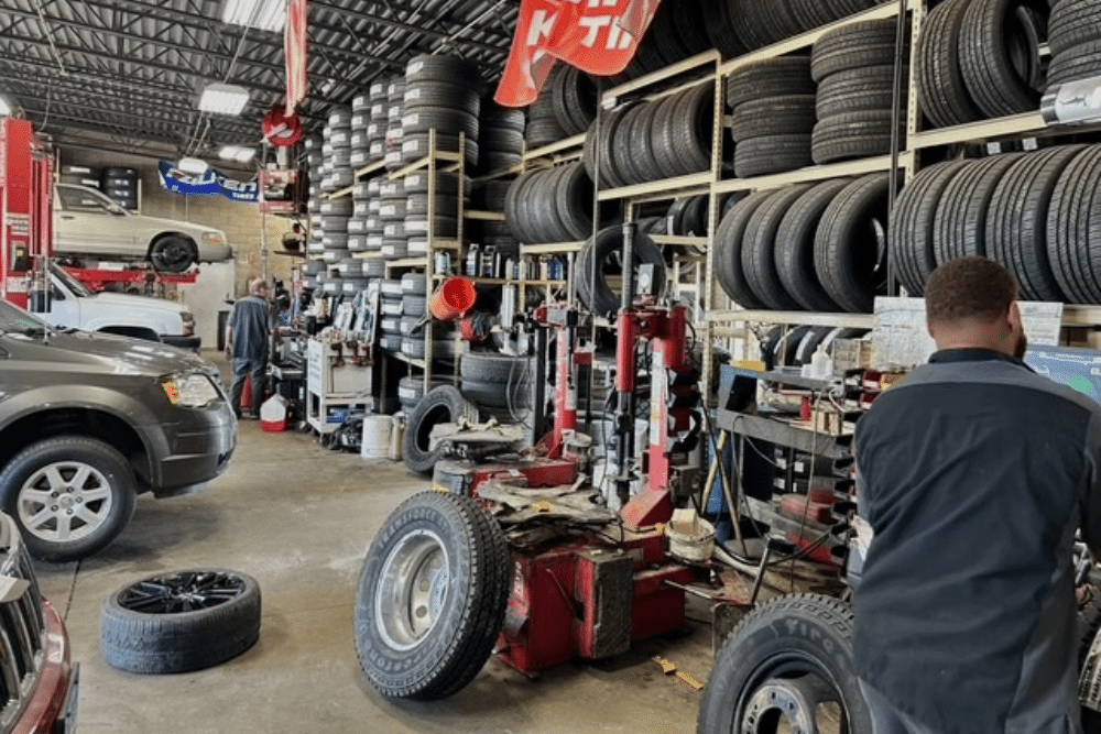 Auto Mechanic Service in Jackson, MO At Charlie's Tire and Automotive. Professional auto mechanics managing tire equipment and vehicle repairs at an auto repair shop